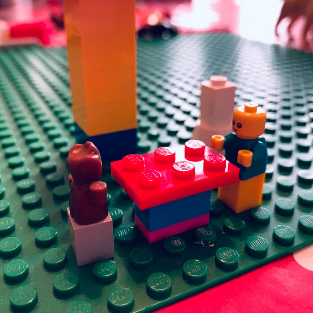 A child's lego creation – a table and two stools for very small lego people: a baby and a baby Groot